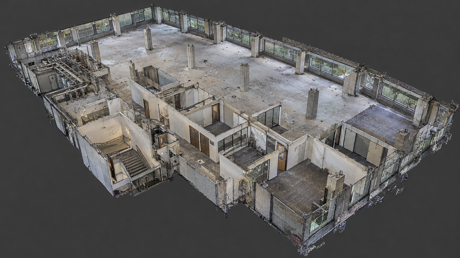 Example of the 3D laser scanning in West Palm Beach deliverable presented as point cloud visualization of a commercial interior showing columns, office partitions, windows, stairs, and exposed piping.
