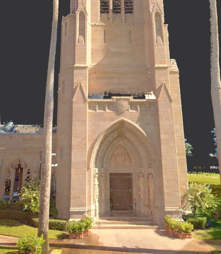 Exterior point-cloud view of a stone church entrance and bell tower